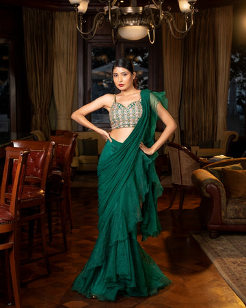 Bottle green pre-draped skirt saree in crepe and organza