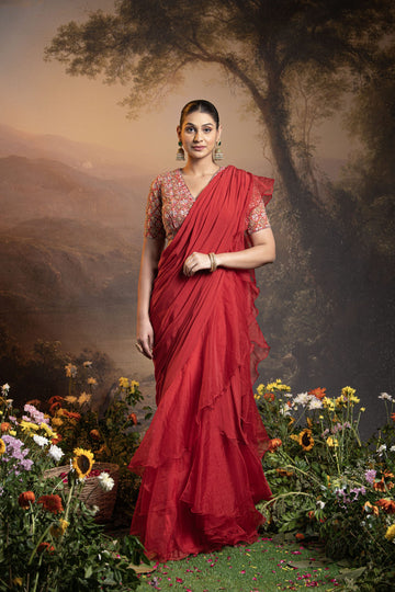 Red pre draped ruffle saree with embroidered blouse