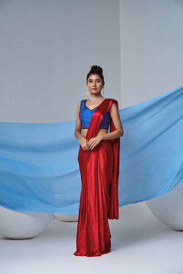 Red satin pre-draped saree with electric blue blouse