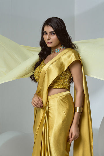Mustard textured satin pre-draped saree with beaded blouse