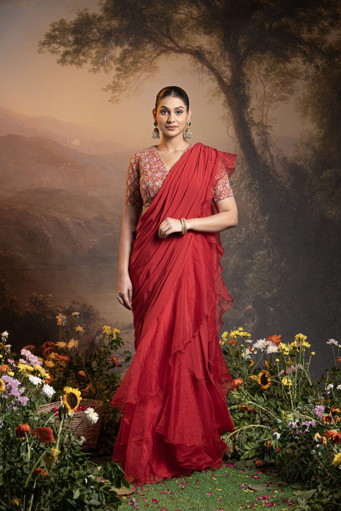 Red pre draped ruffle saree with embroidered blouse