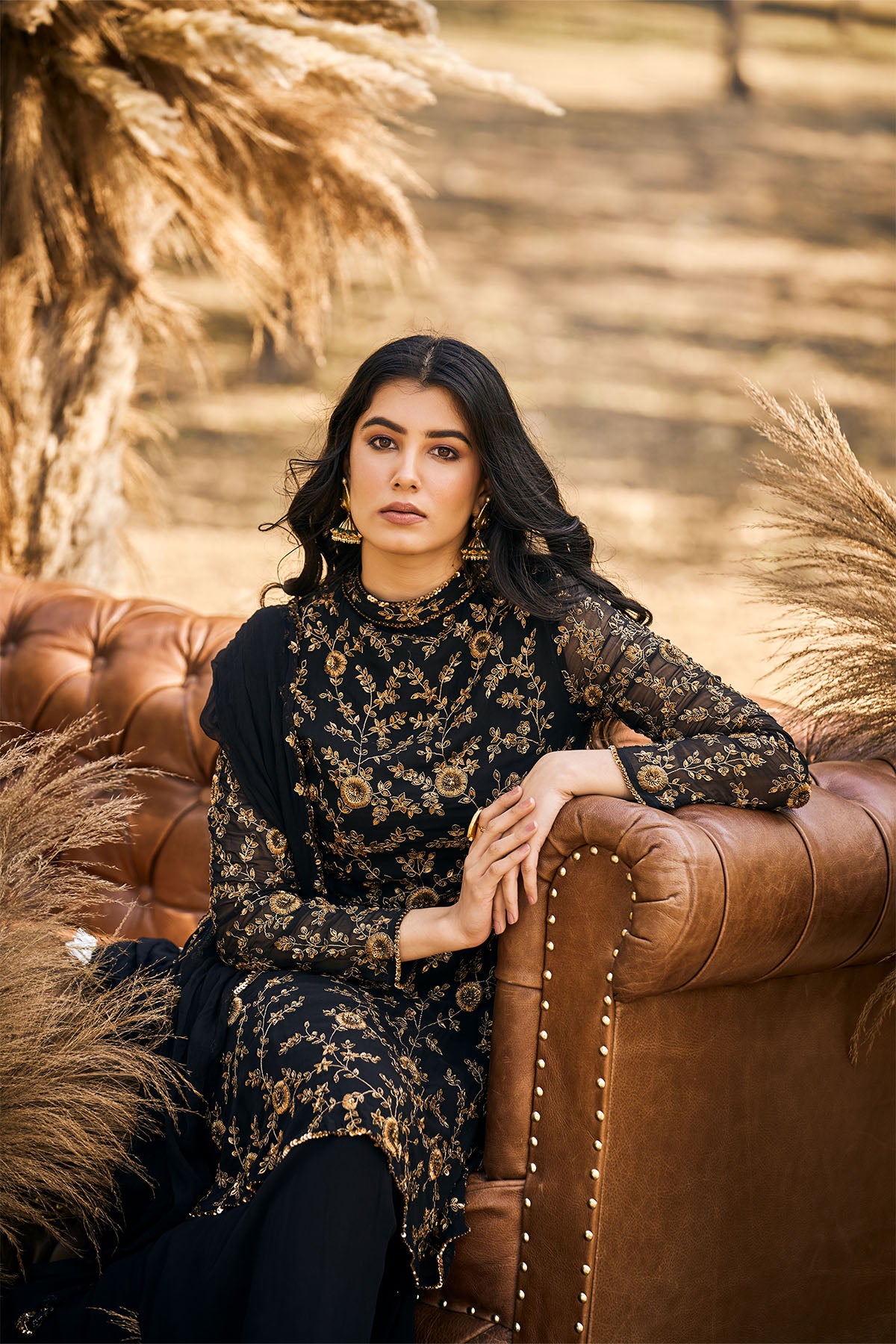 Black beaded peplum with Sharara and dupatta in georgette