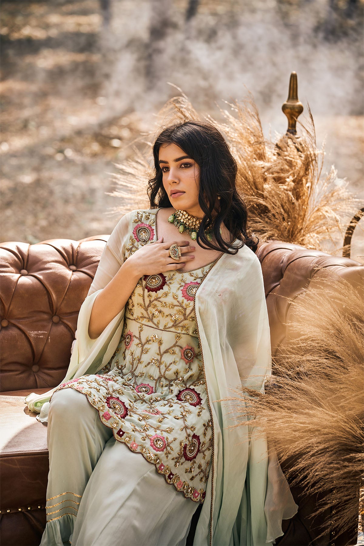 Mint green embroidered peplum with Sharara and dupatta in georgette
