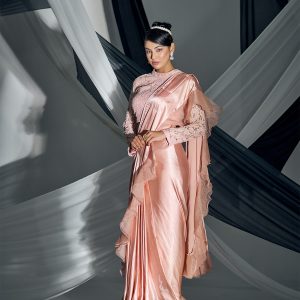 Pink satin pre-draped saree with lacy blouse