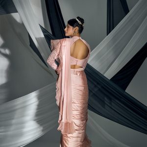 Pink satin pre-draped saree with lacy blouse