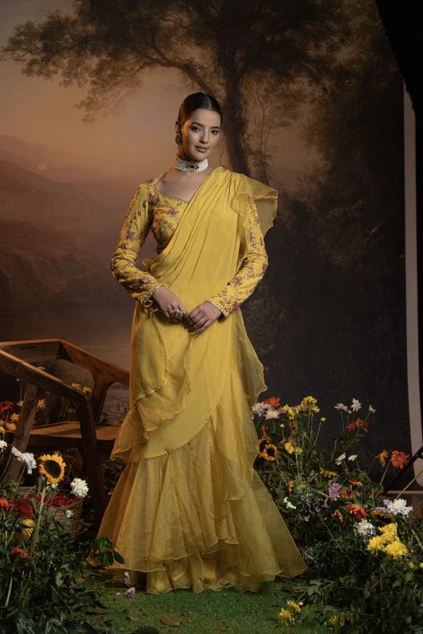 Yellow pre draped ruffle saree with embroidered blouse